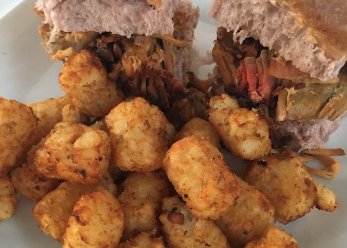 Try our pulled pork sliders with a generous portion of tater tots